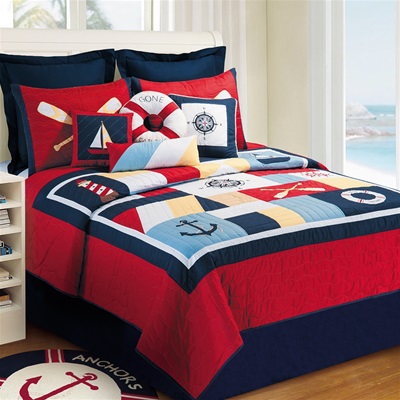 Original nautical theme quilt with detailed applique and embroidery. A crisp palette of navy and red and light blue on a cream background. Quilts are oversized for todayÂ¹s high profile mattresses.